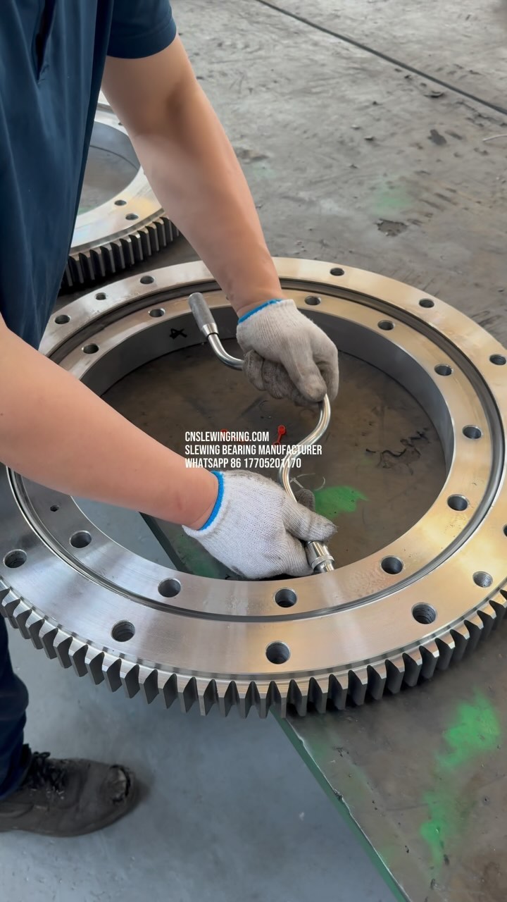 Grease filling hole for slewing bearing.