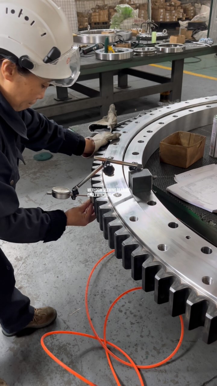 We are measuring the highest point of tooth runout on this slewing bearing and will mark it with…