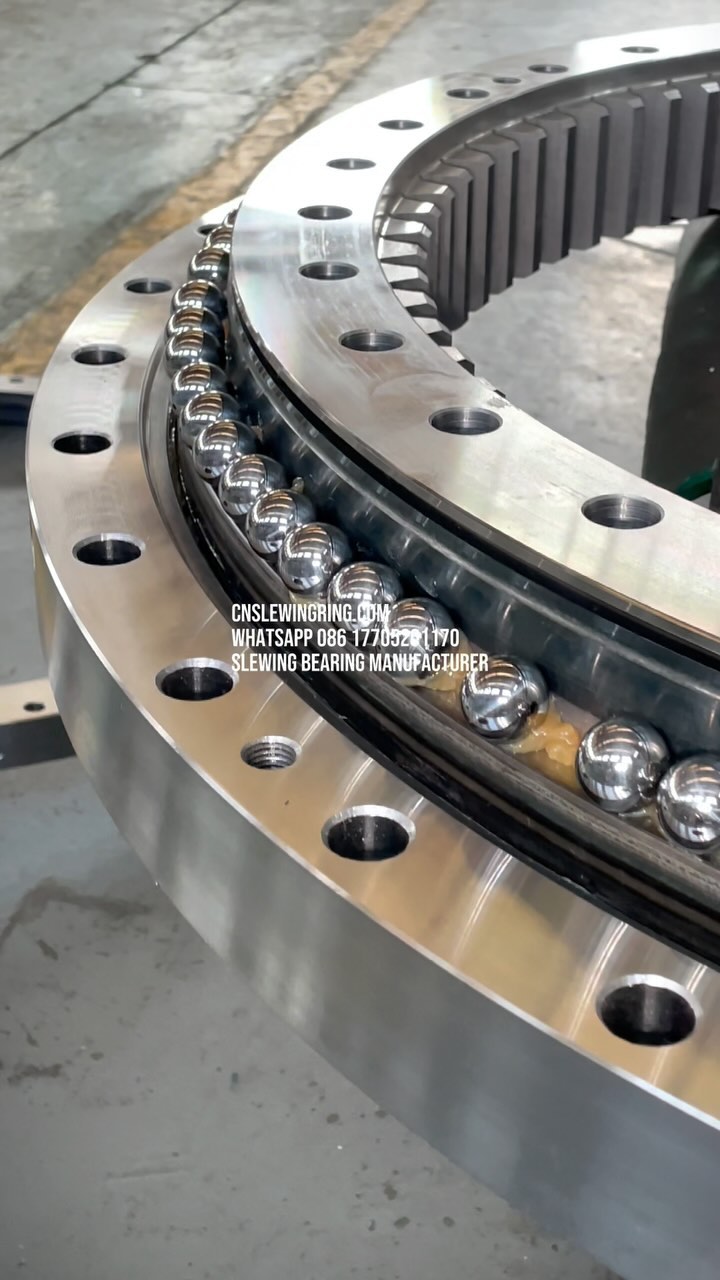 This is a slewing bearing with double rows of raceways. We are installing steel balls and isolation blocks…