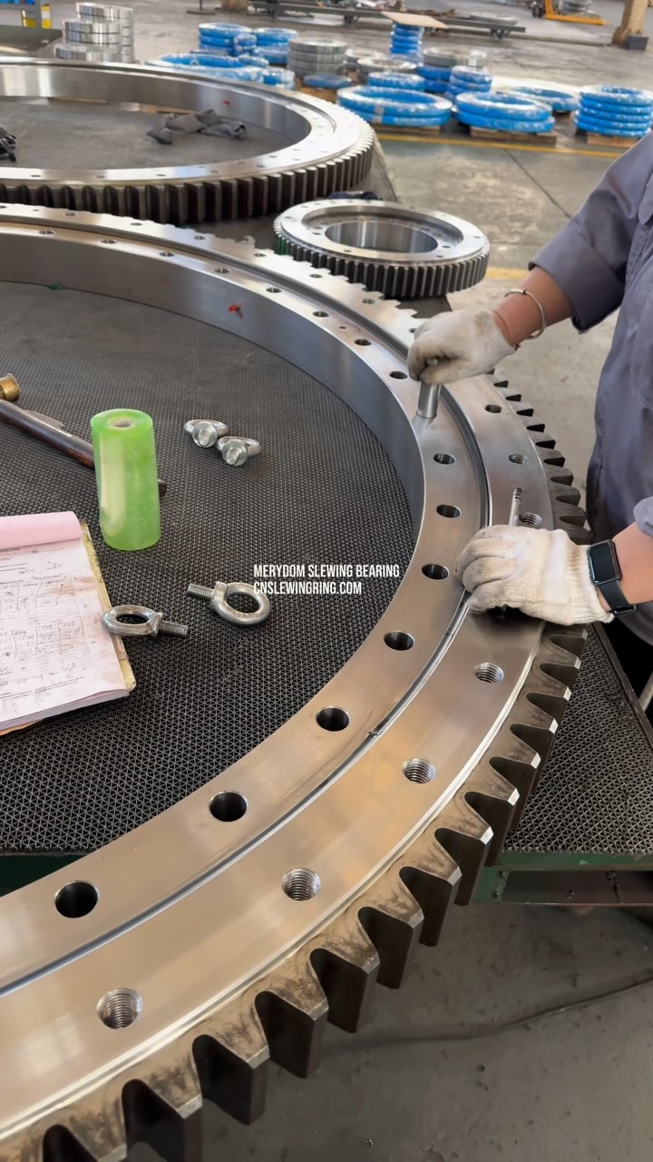 Checking the mounting holes of the slewing bearing.
