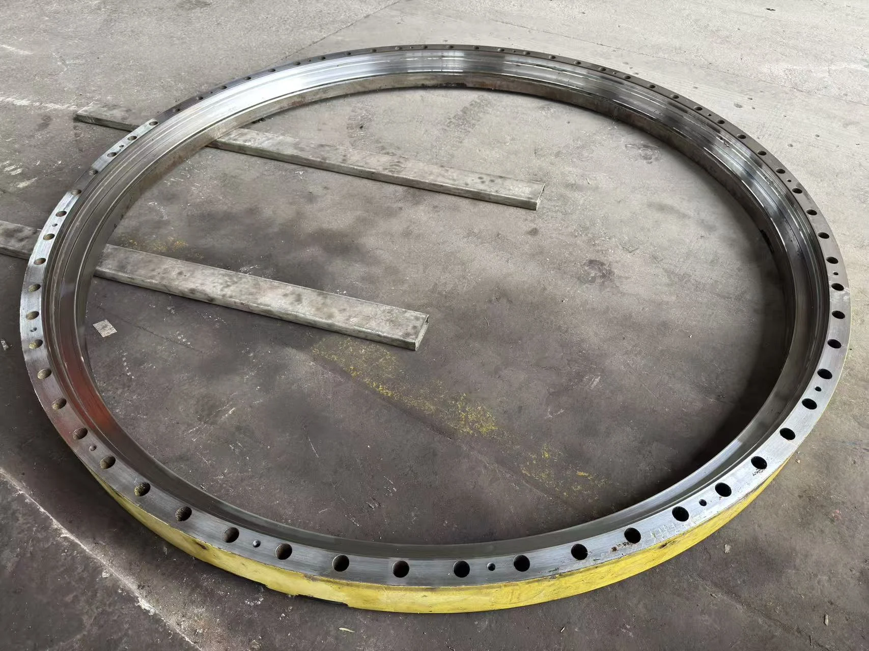 Machined large slewing bearing ring prepared for non-destructive testing.